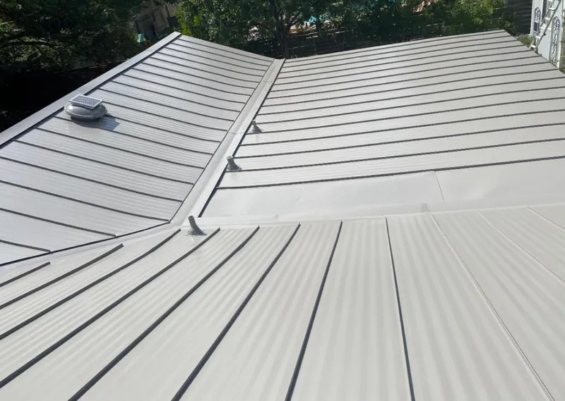 Solar attic fan installed on a metal roof for Roof Ventilation in Running Springs
